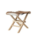 Folding wood stool with goal fur on a white background