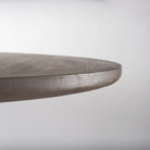 Close up of Terra Dark Brown Wood Round Fluted Dining Table on a white background
