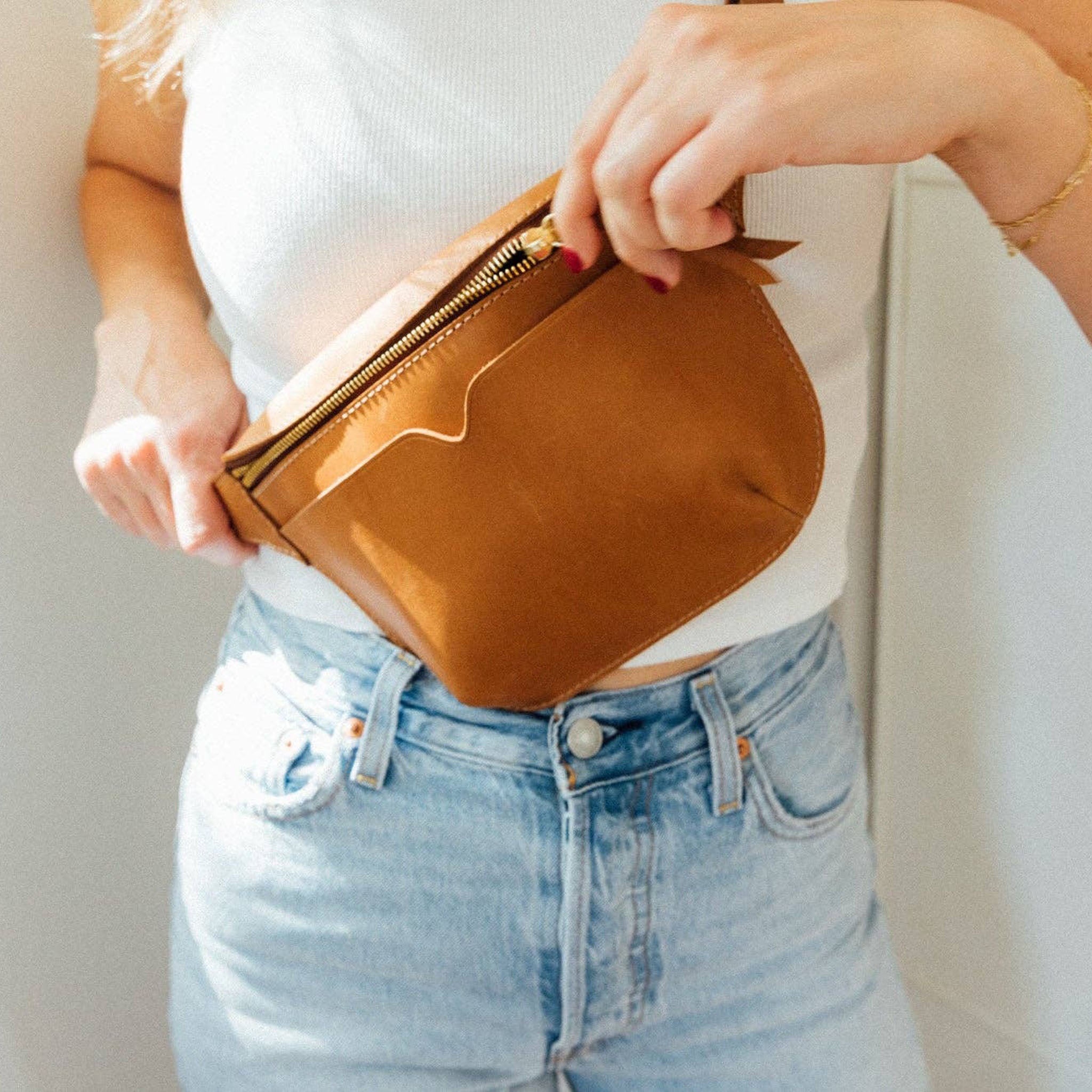 The Leather Sling Bag on a model at Addison West