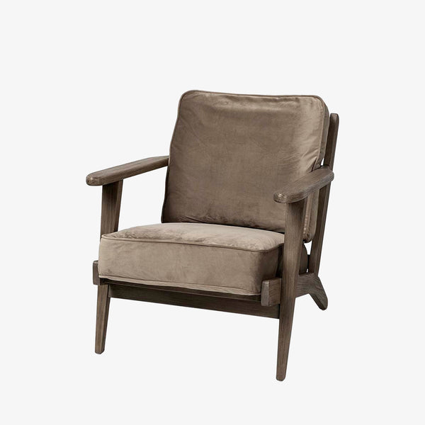 Wood arm chair with dark brown stain and olive velvet removable cushions on a white background