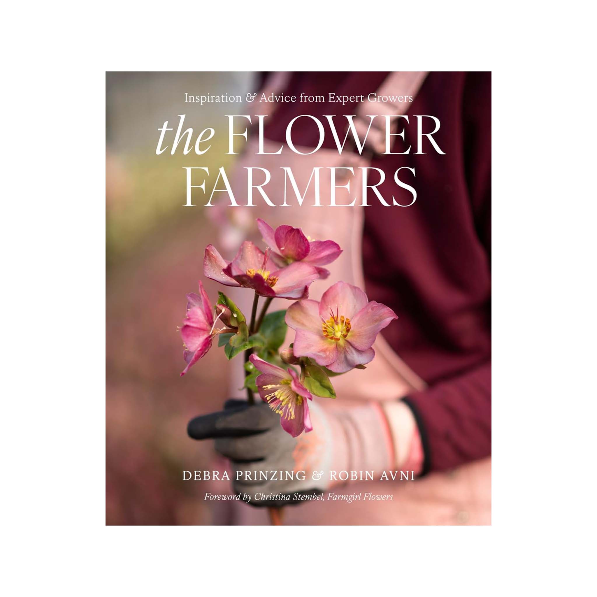 Front cover of book titled The Flower Farmers with a woman in a pint apron holding pink flowers.