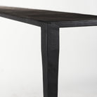 Black iron console table with narrow depth on a white background