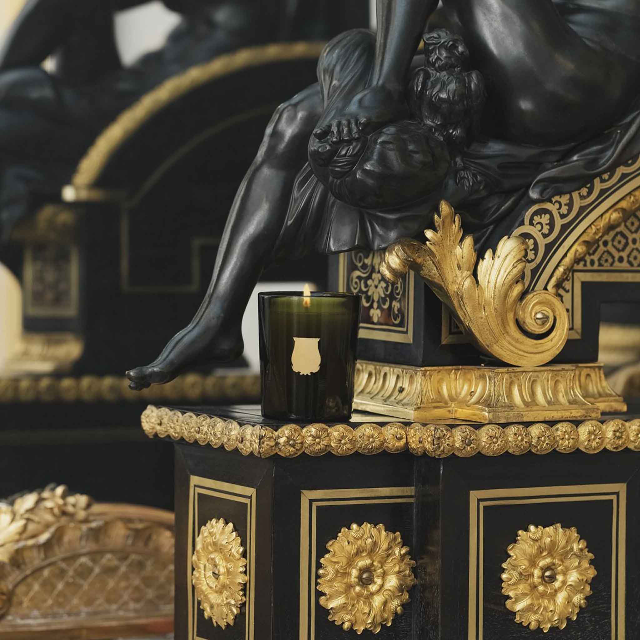 Trudon Ernesto "Leather & Tobacco" Petite Candle a black statue at Addison West