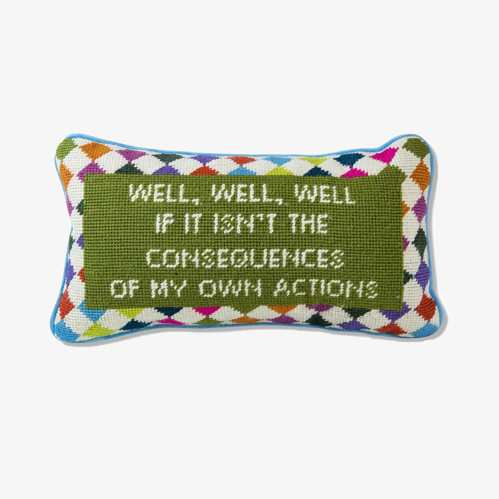 Furbish brand needlepoint pillow with saying 'well, well, well, if it isn't the consequences of my own actions' on a white background