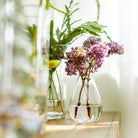 Woodstock Bud Vase on a table with flowers at Addison West