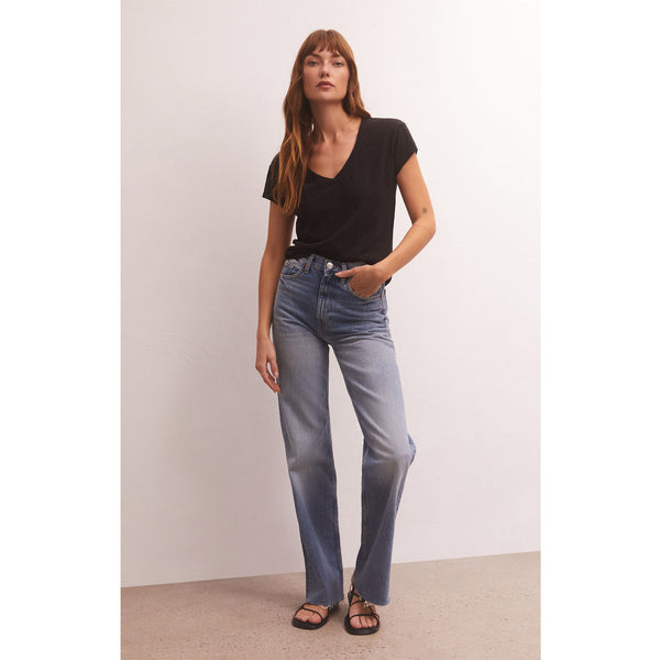Model wearing Z Supply Modern V-Neck Tee in Black with jeans and black sandals