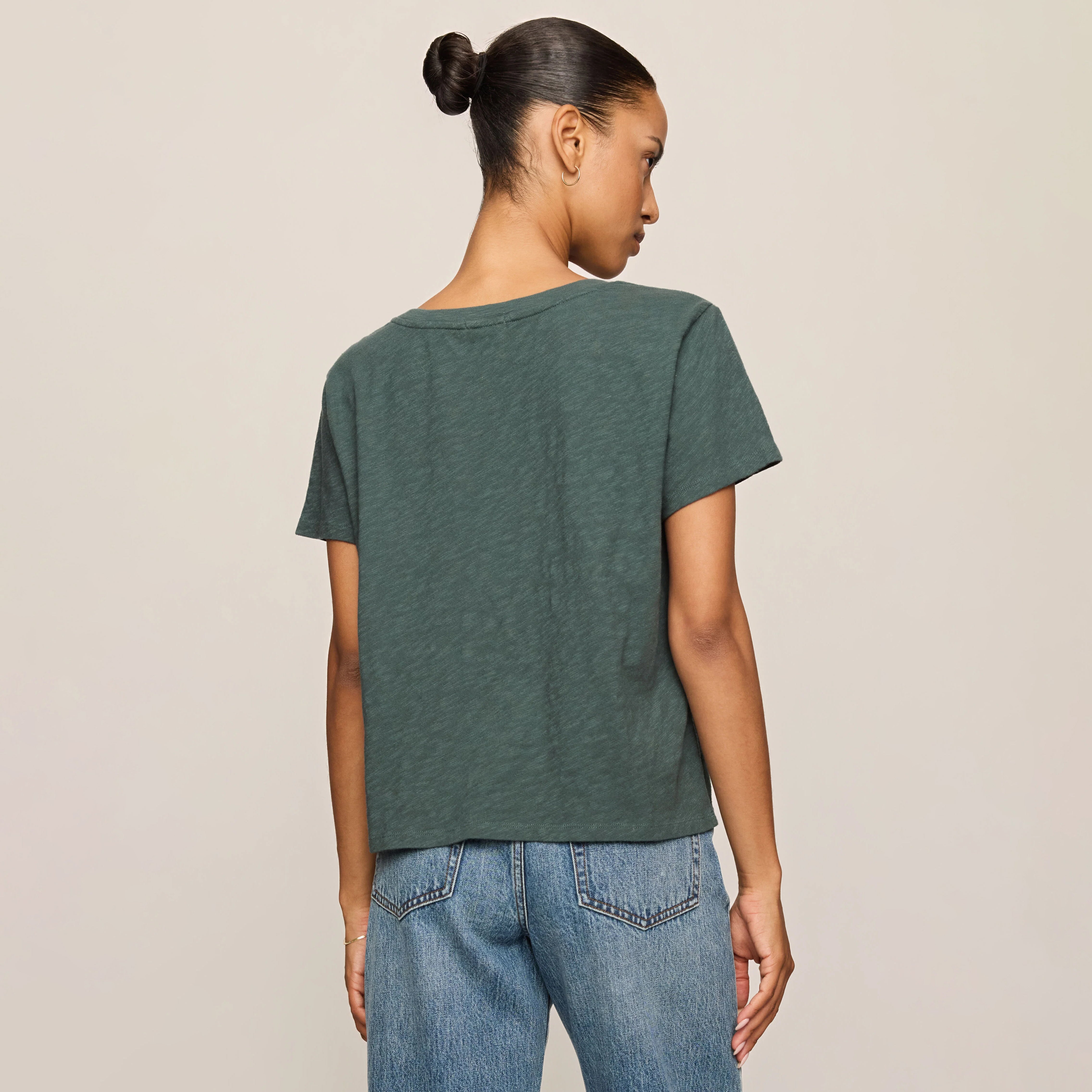 Z Supply Nomad V-Neck Tee in Emerald Cove shown on model on plain background.