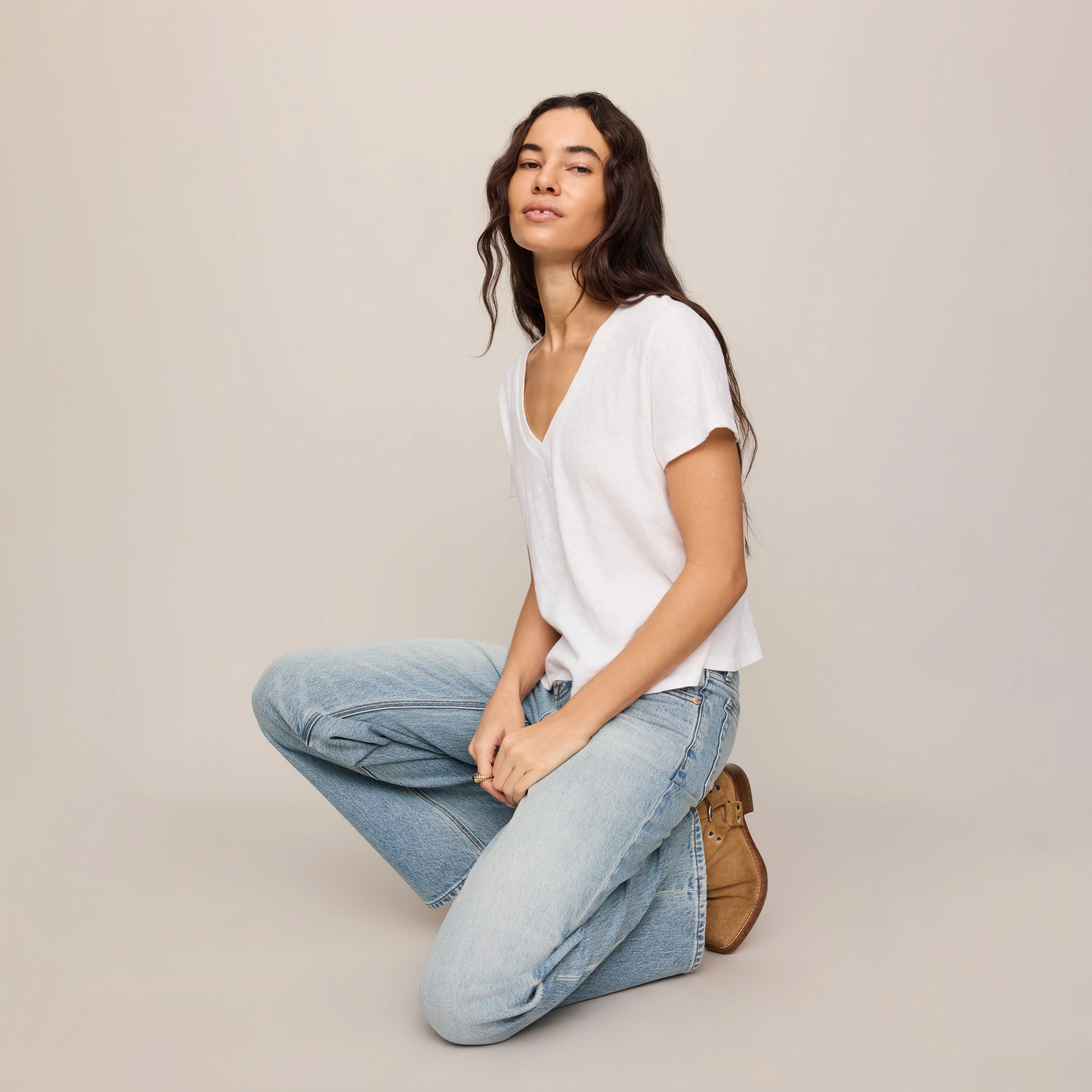 Z Supply Nomad V-Neck Tee in White shown on model on plain background.
