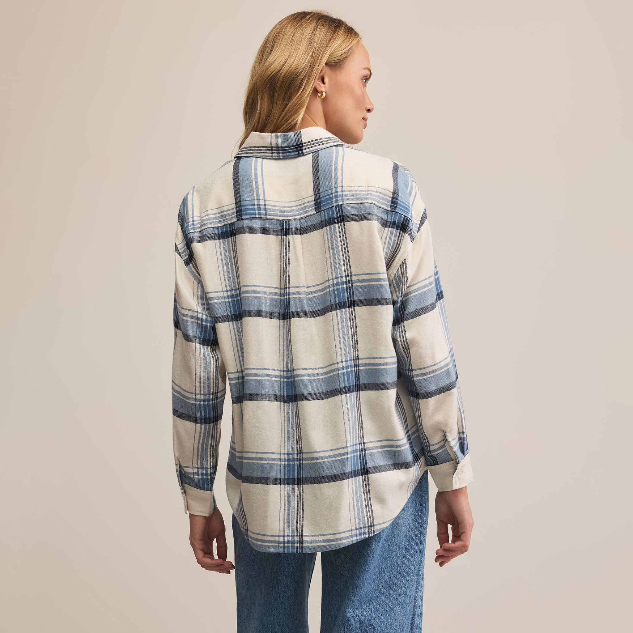 Z Supply River Plaid Button Up in Vintage Indigo on a beige background at Addison West