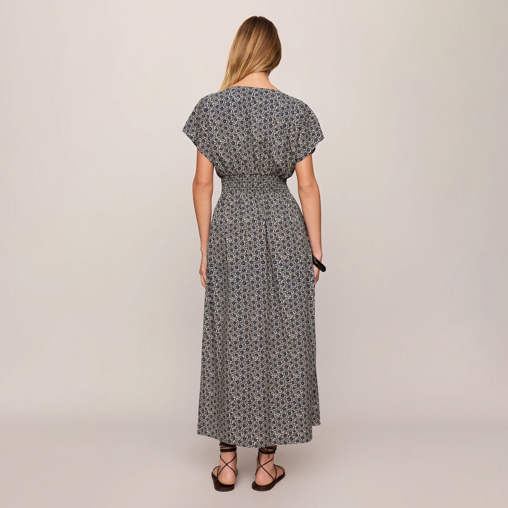 Z Supply Sanna Iris Floral Midi Dress in Eclipse shown on model on plain background.