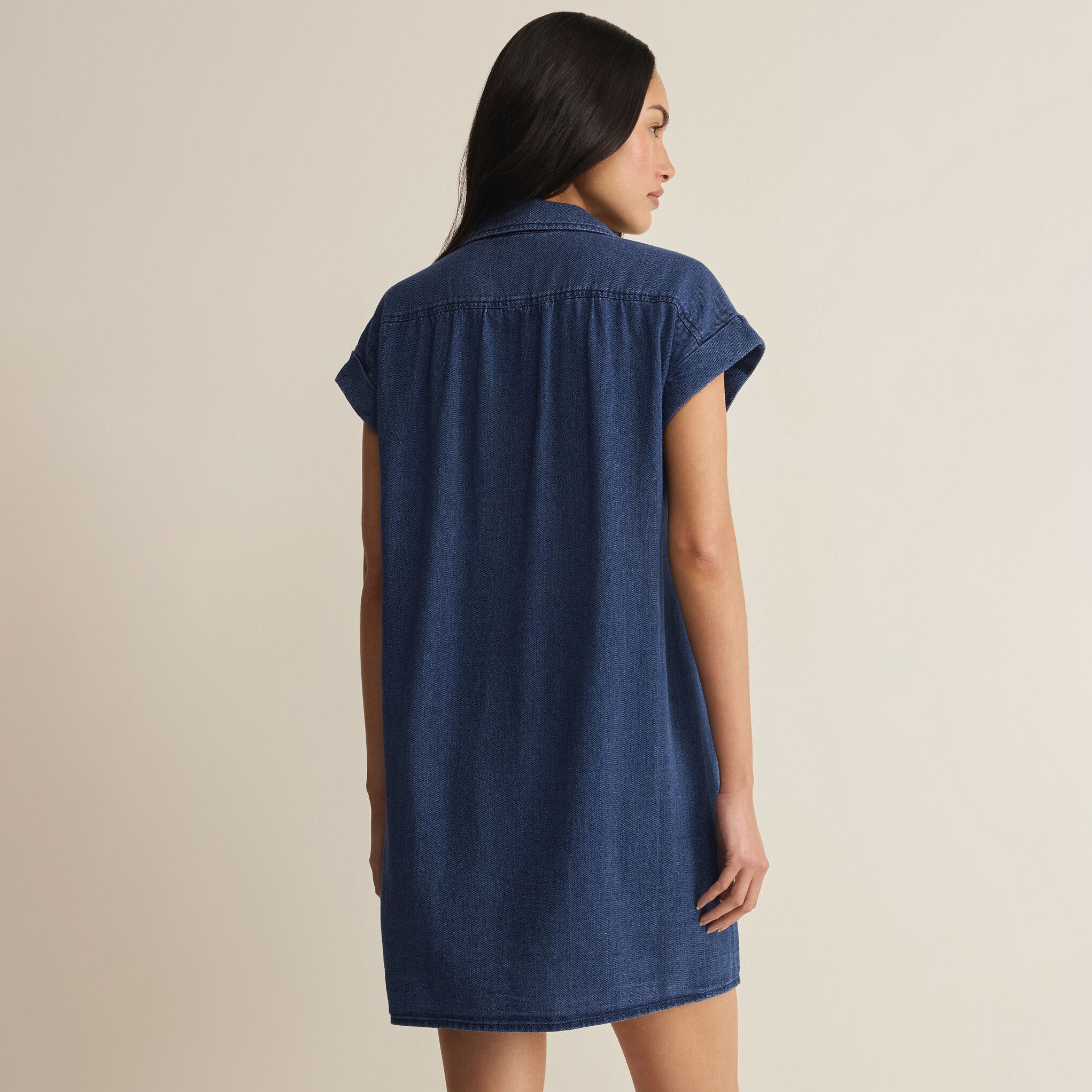 Woman wearing Z Supply Shellbound Twill Dress in Twilight Blue on plain background at Addison West.