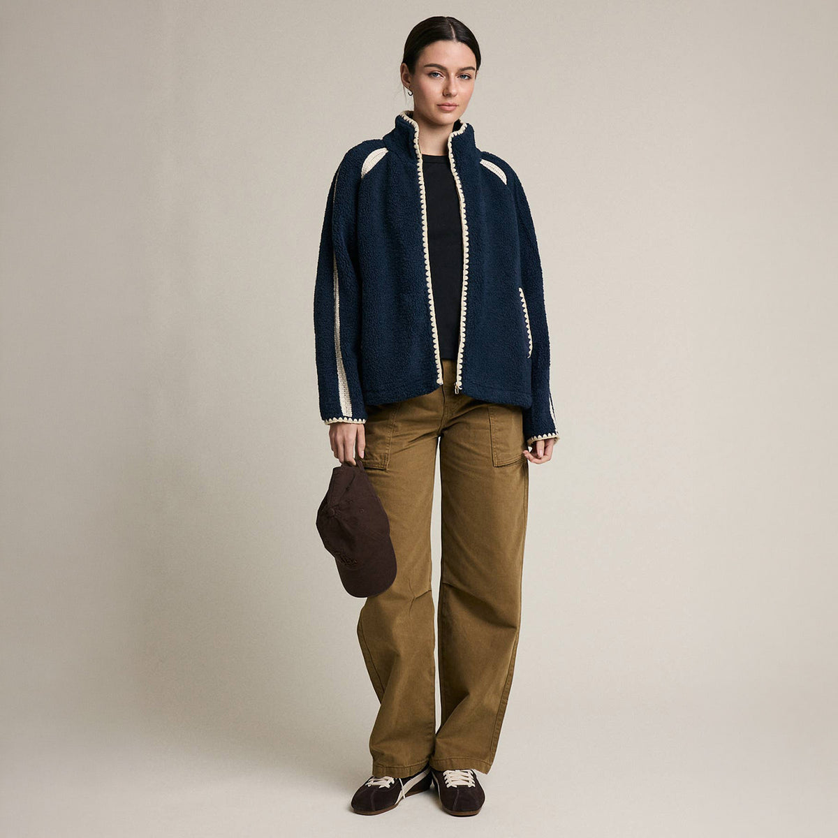 Contrast Trim Sherpa Zip-Up Jacket in Navy on a model at Addison West