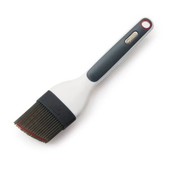 Zyliss Basting brush with a gray handle and black bristle head on a white background