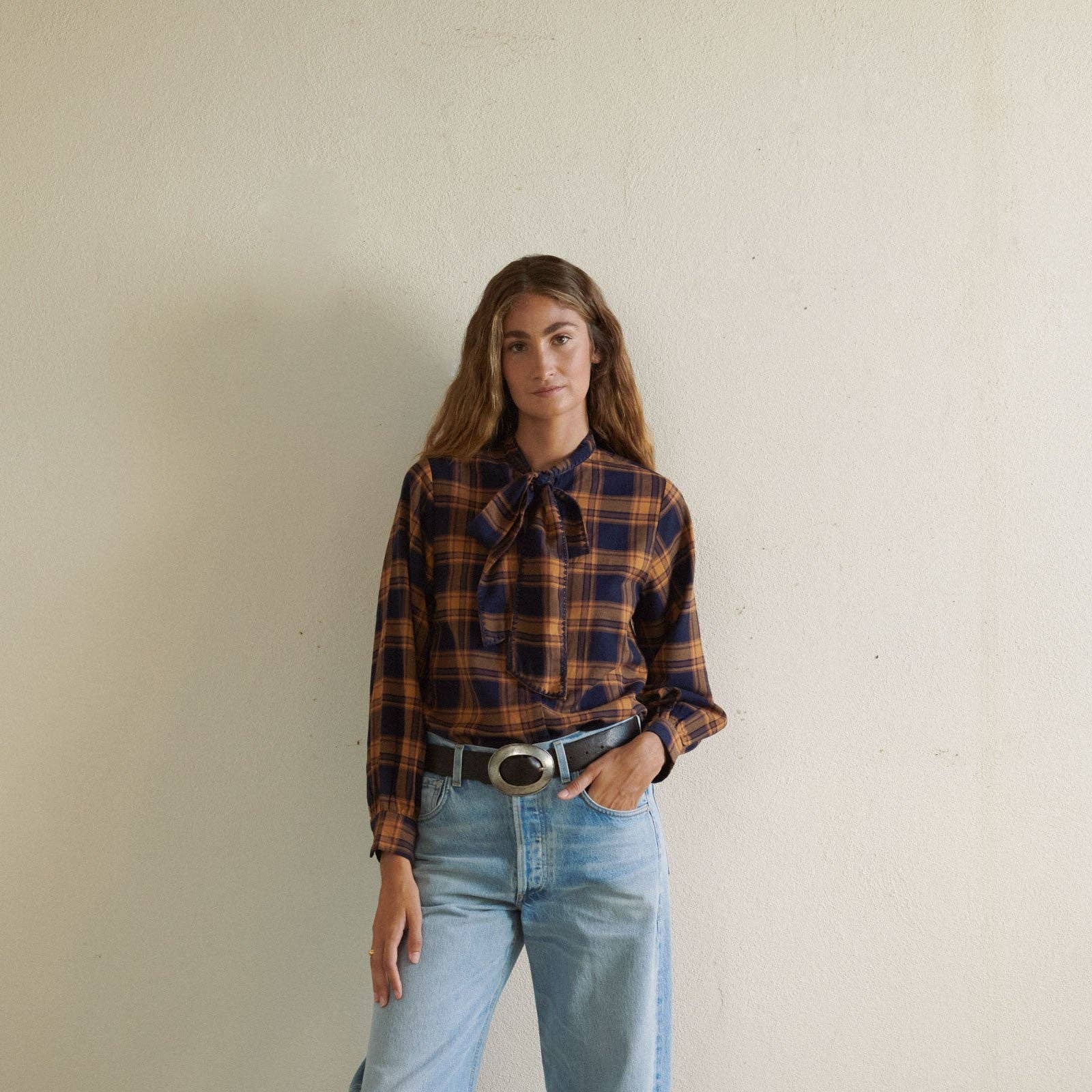 Lily Blouse in Navy on a white background at Addison West