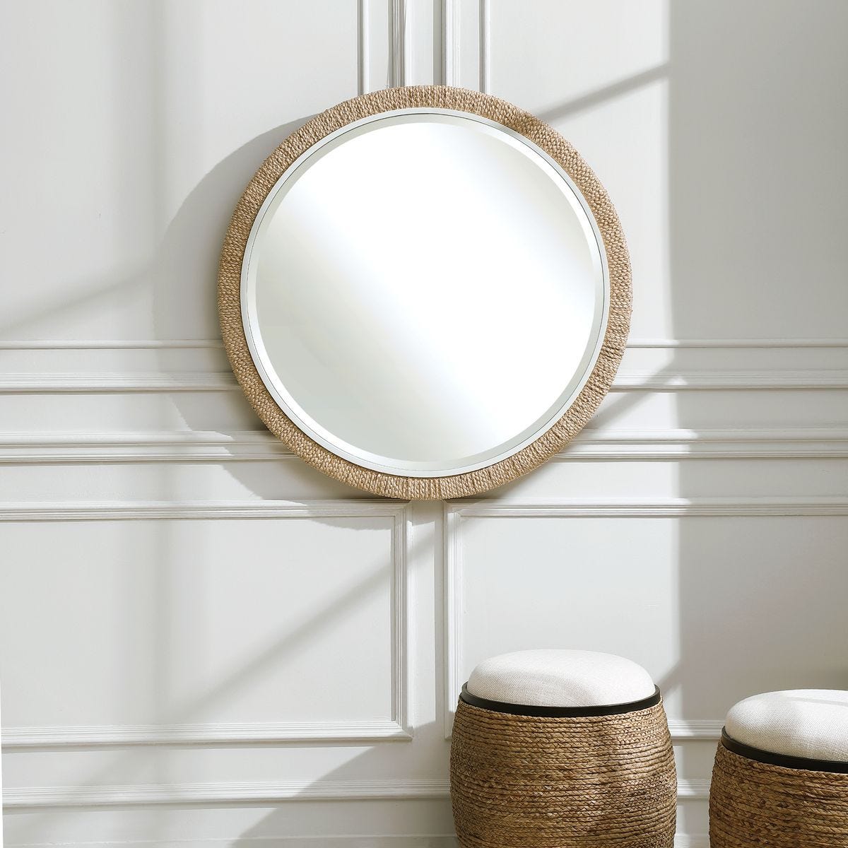 Carsten Round Accent Mirror on a white wall in a living room at Addison West