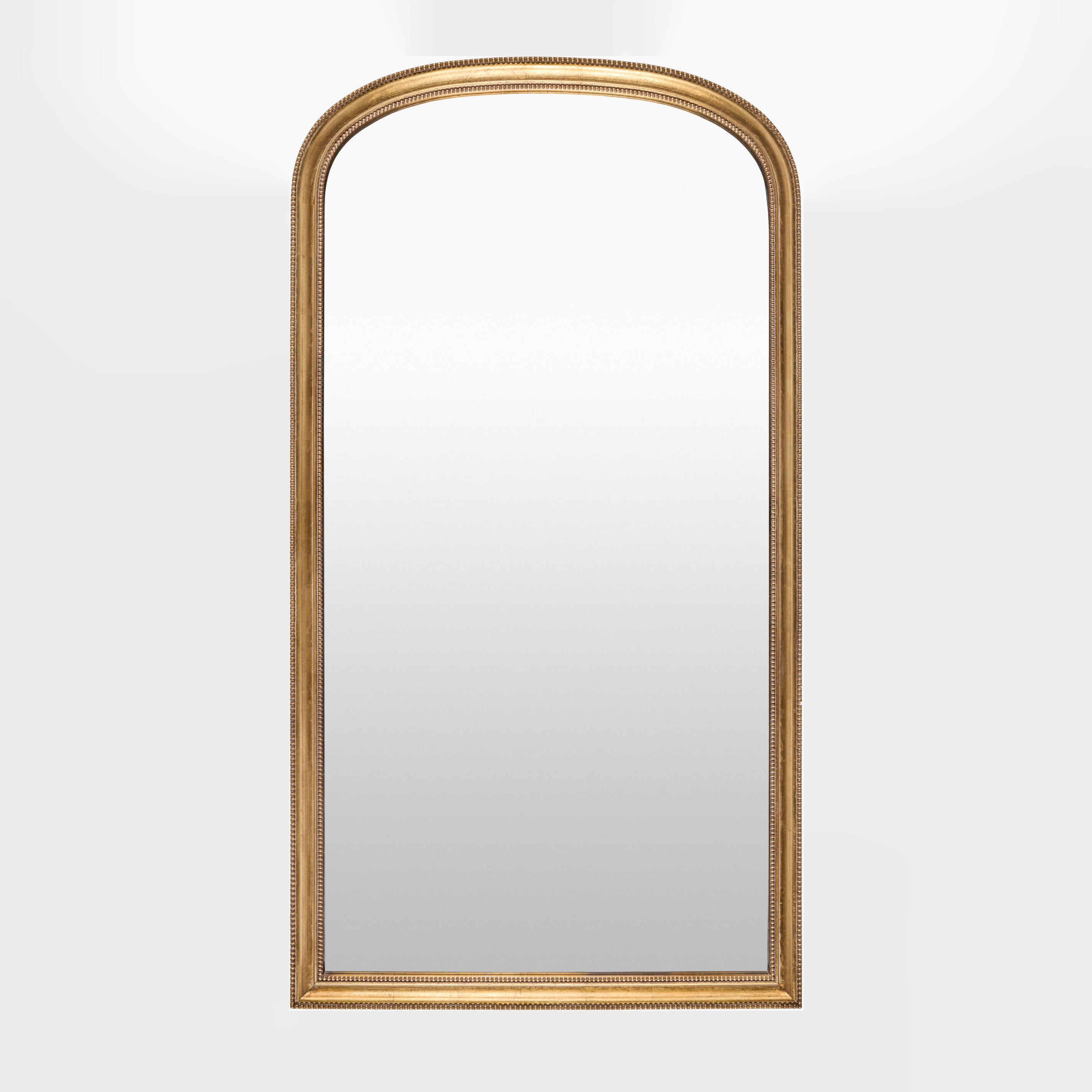 Nalanda Full Length Mirror in Antiqued Gold on a white background at Addison West