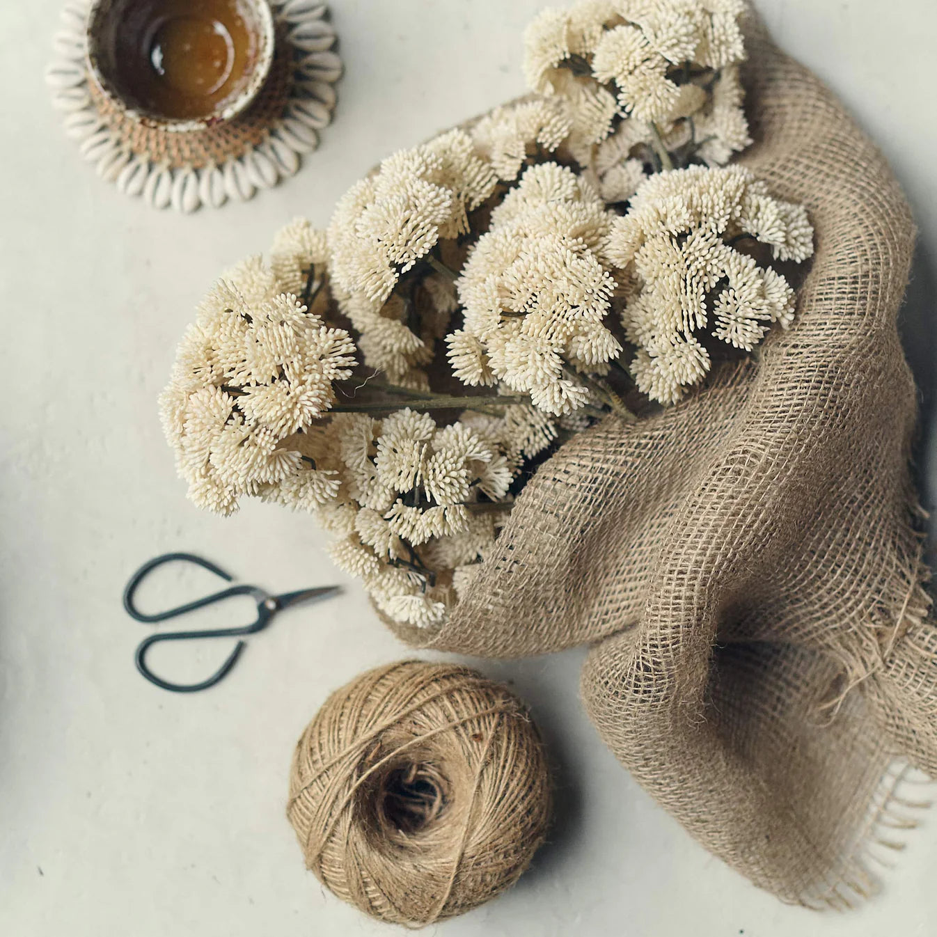 Abigail Ahern Faux Sedum in Cream faux florals on a beige background at Addison West