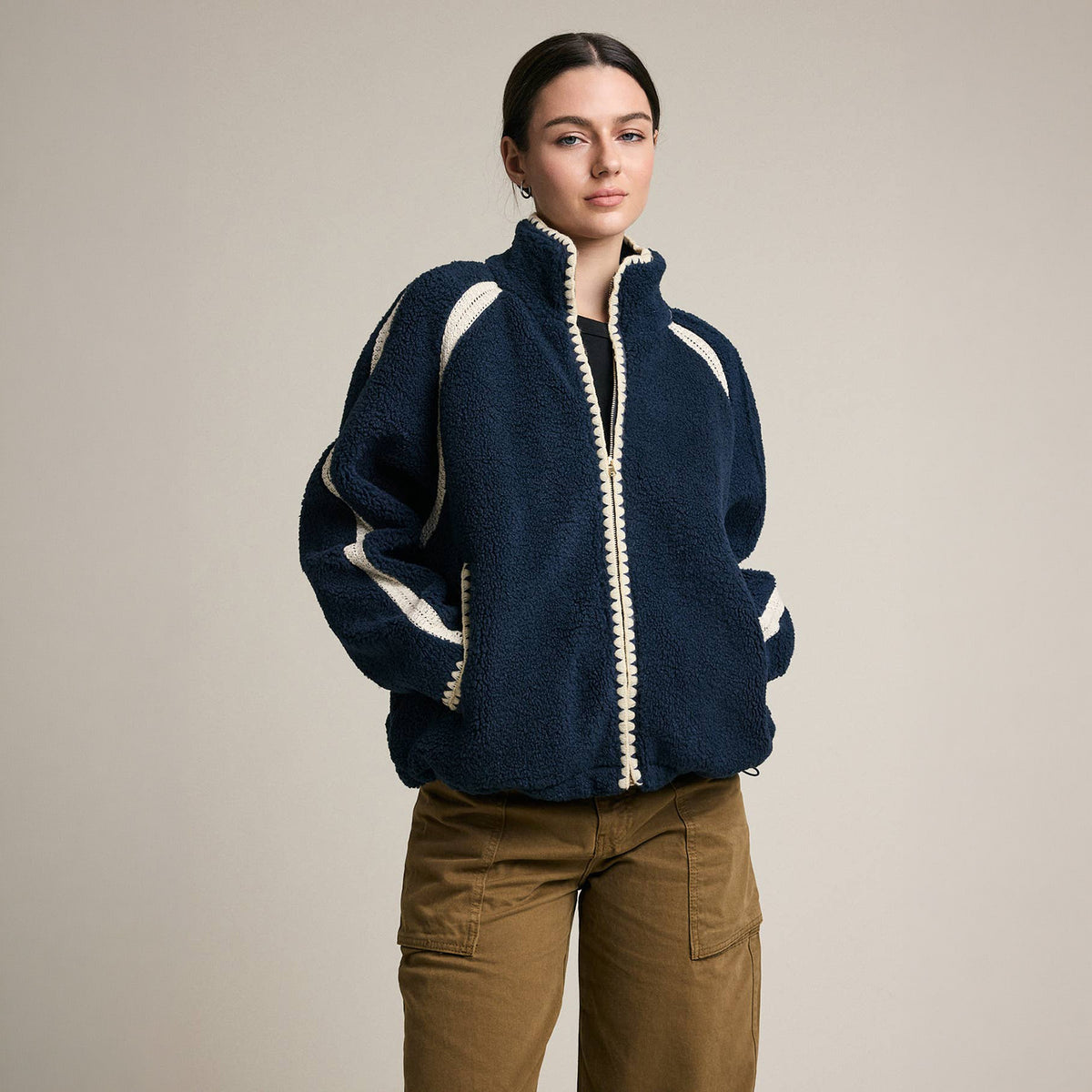 Contrast Trim Sherpa Zip-Up Jacket in Navy on a model at Addison West