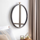 Birdsong Accent Mirror on a white wall in a bedroom at Addison West