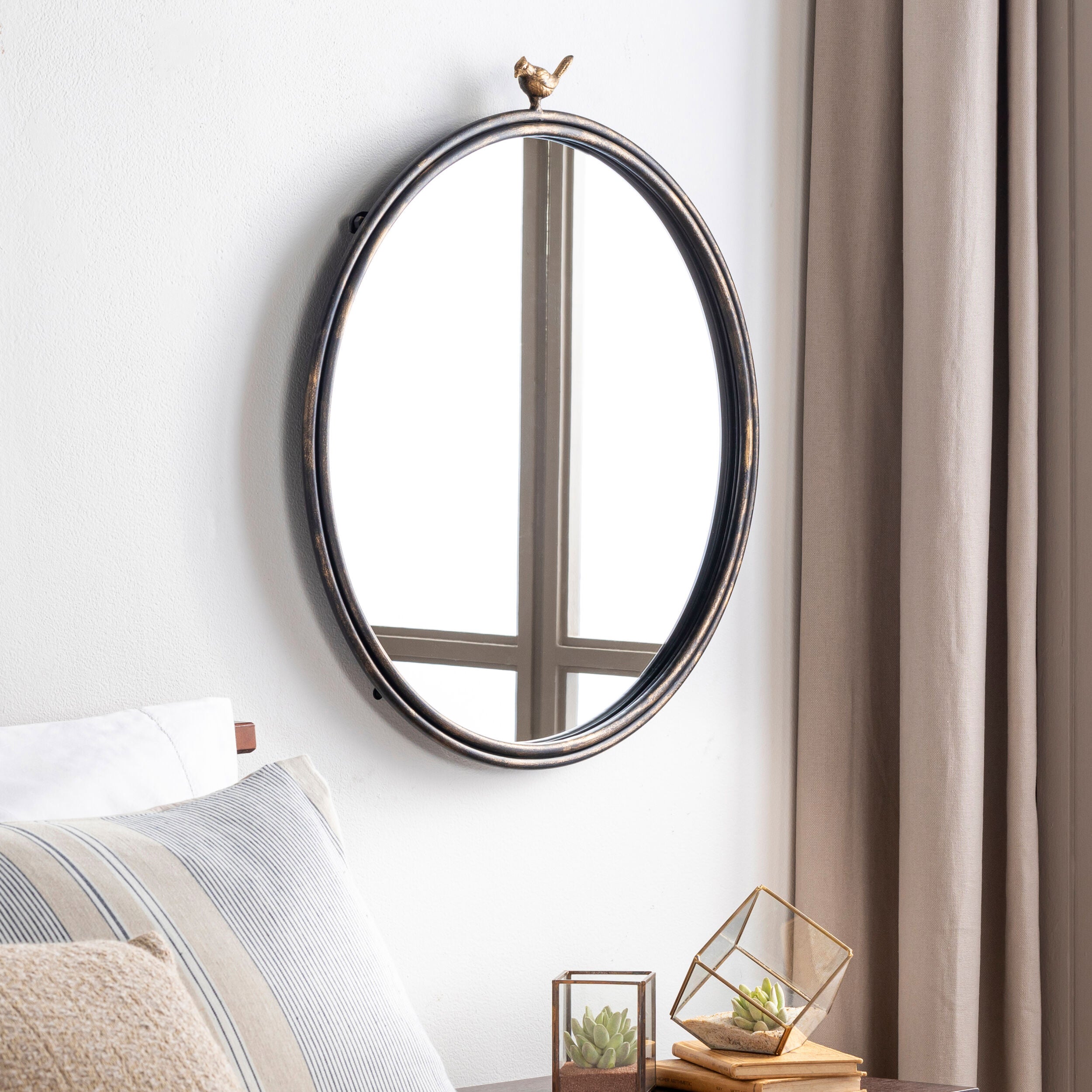 Birdsong Accent Mirror on a white wall in a bedroom at Addison West