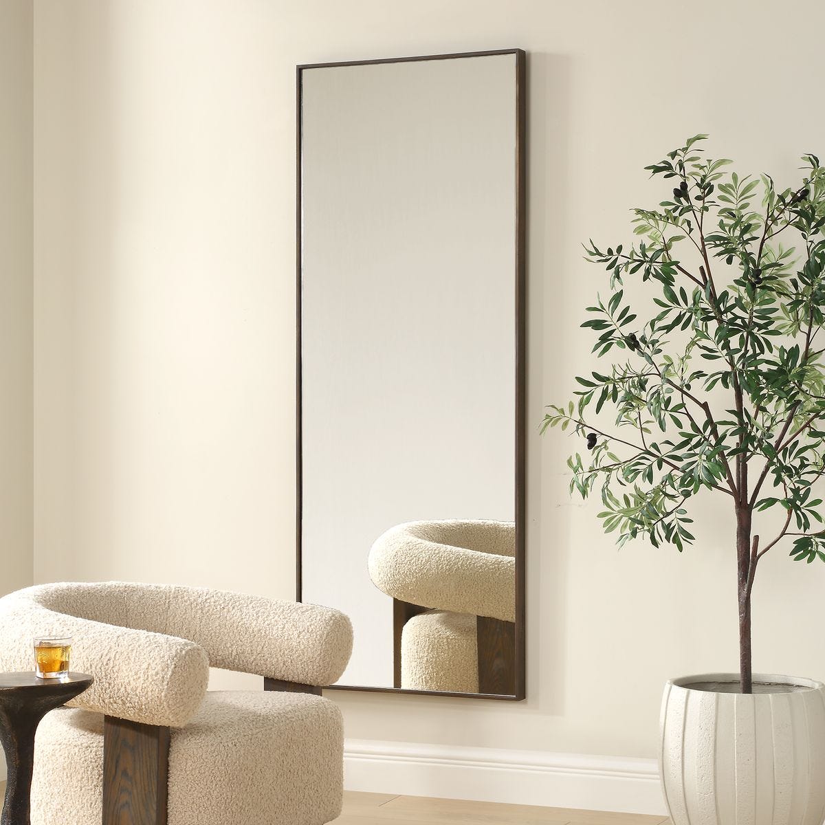 Patridge Full Length Mirror on a beige wall in a living room at Addison West