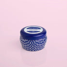 Capri Blue Volcano Signature Blue Mini Tin on a pink background