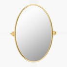 Oval Burnish Accent Mirror in Antiqued Gold on a white background at Addison West