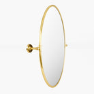 Oval Burnish Accent Mirror in Antiqued Gold on a white background at Addison West