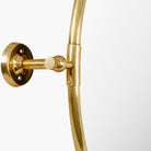 Close up of Burnish Round Accent Mirror in Antiqued Gold on a white background at Addison West