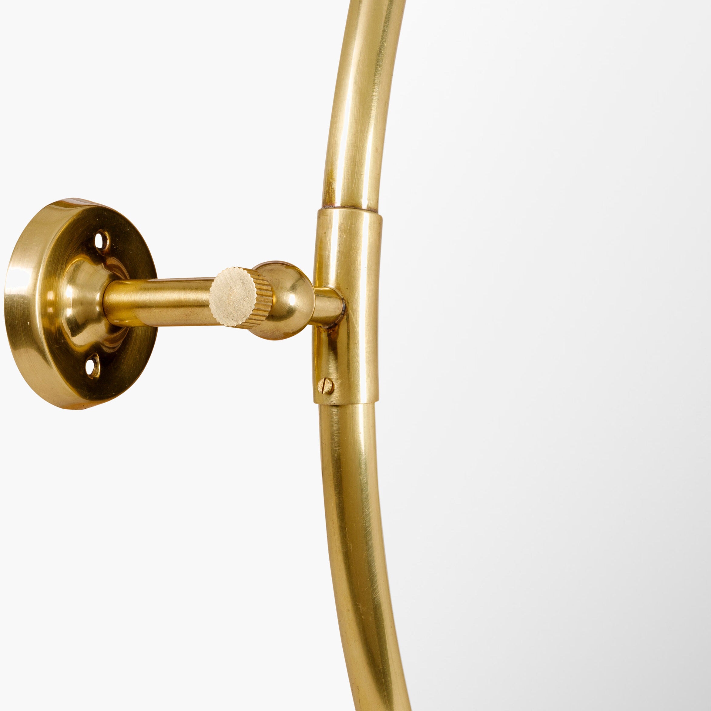 Close up of Burnish Round Accent Mirror in Antiqued Gold on a white background at Addison West