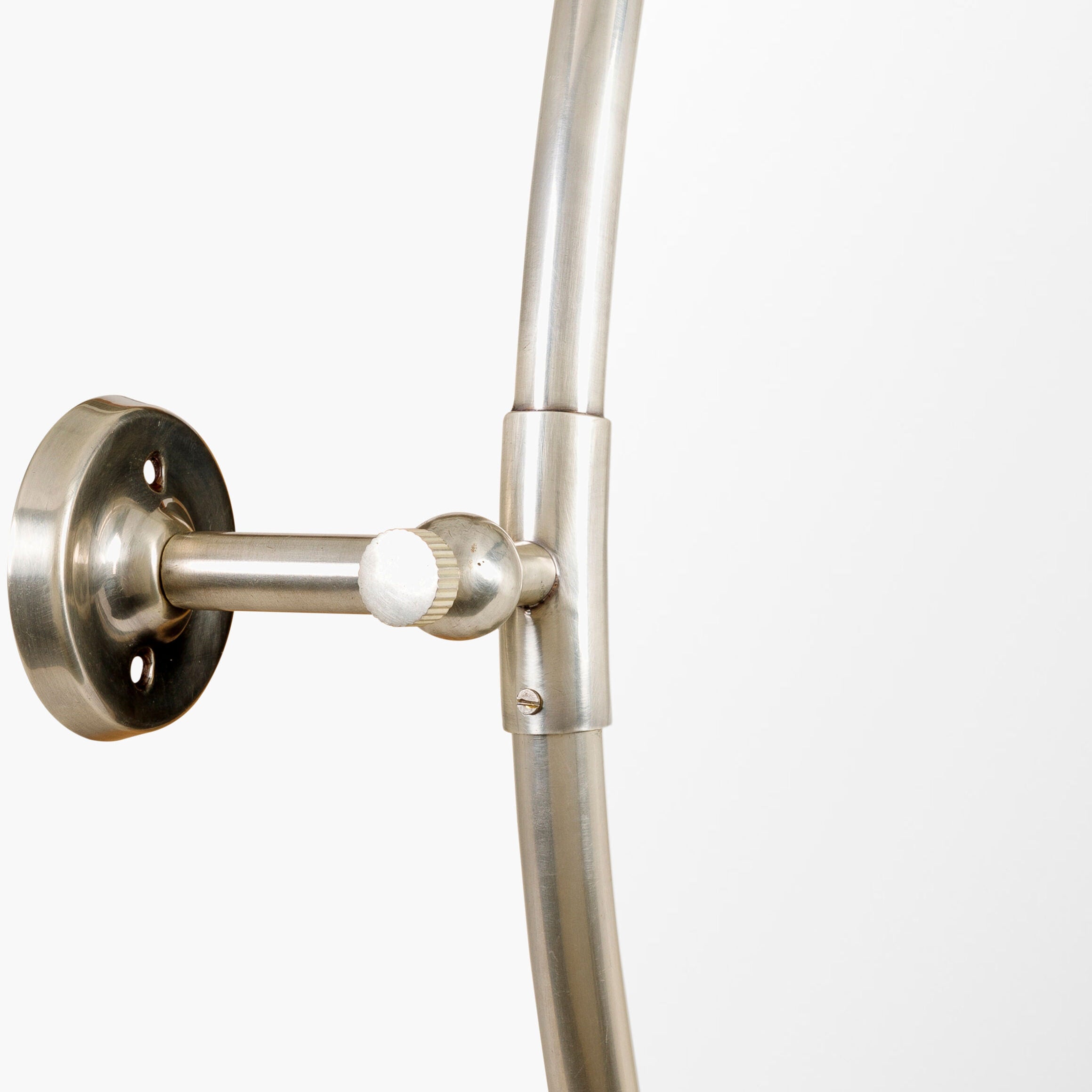 Close up of Burnish Round Accent Mirror in Antiqued Silver on a white background at Addison West