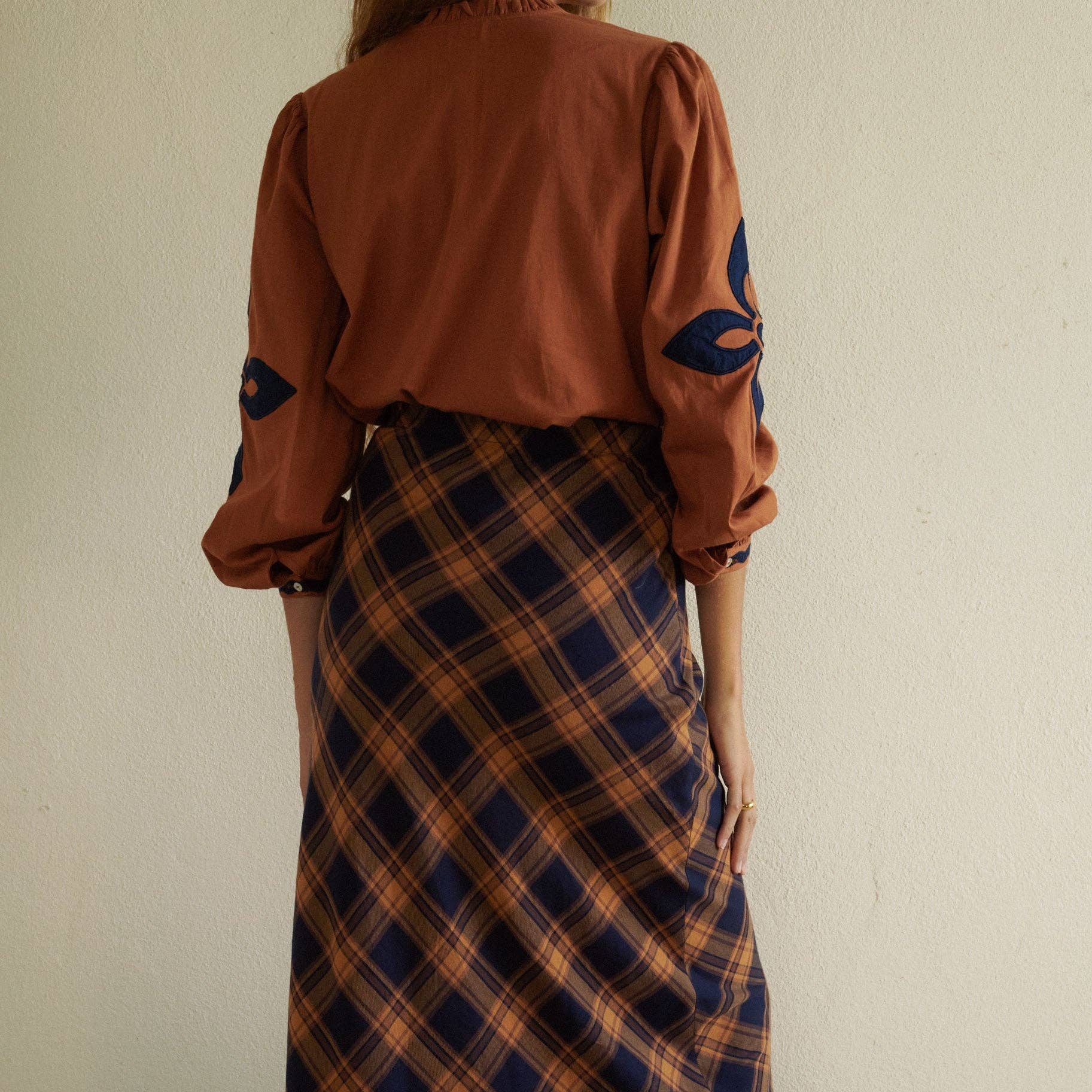 Leonor Blouse in Caramel on a white background at Addison West