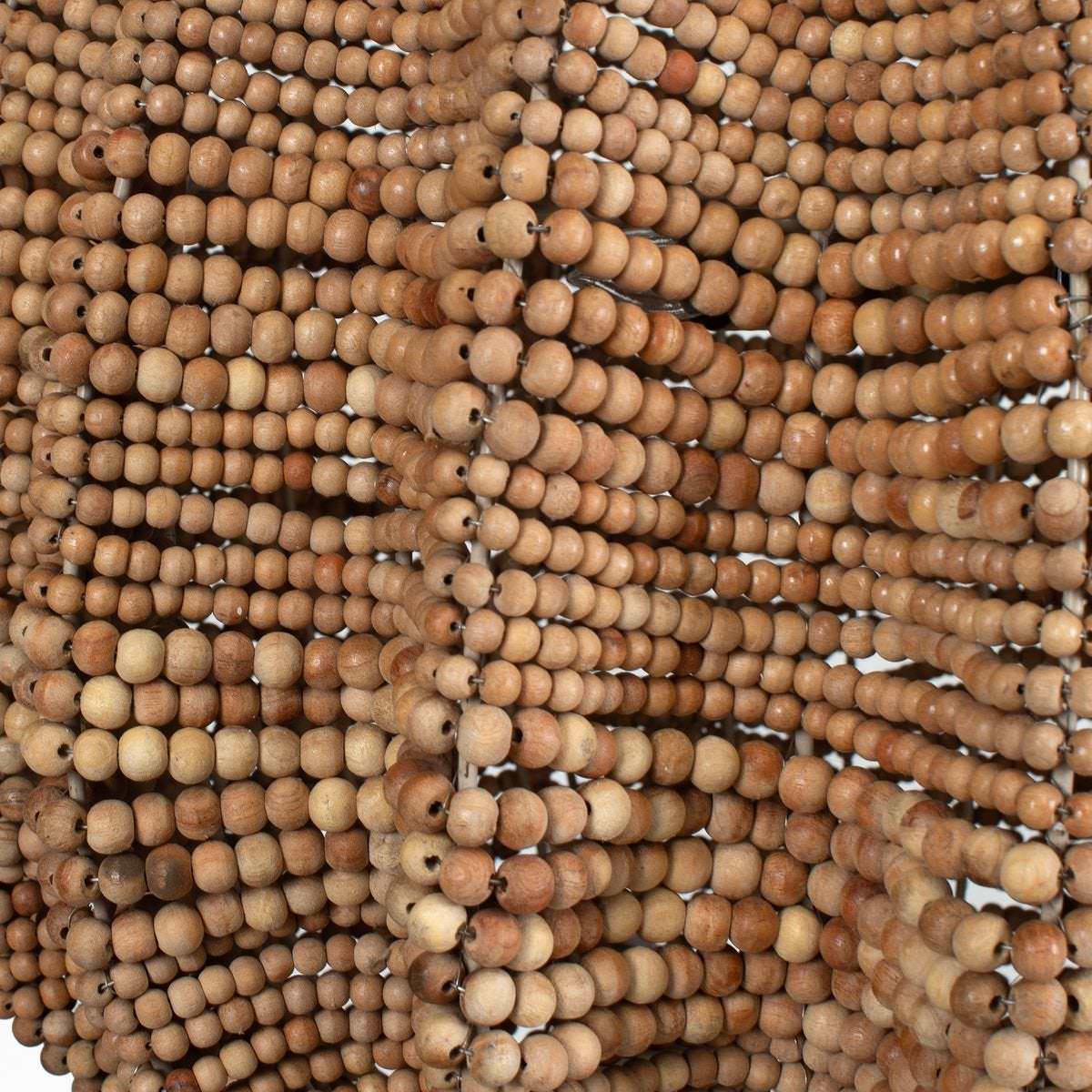 Close up of Kastor Beaded Pendant on a white background at Addison West