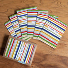 Thank You Stripes Greeting Card, Boxed Set of 6 on a wood table at Addison West