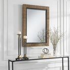 Islenne Accent Mirror on a white wall above a table at Addison West