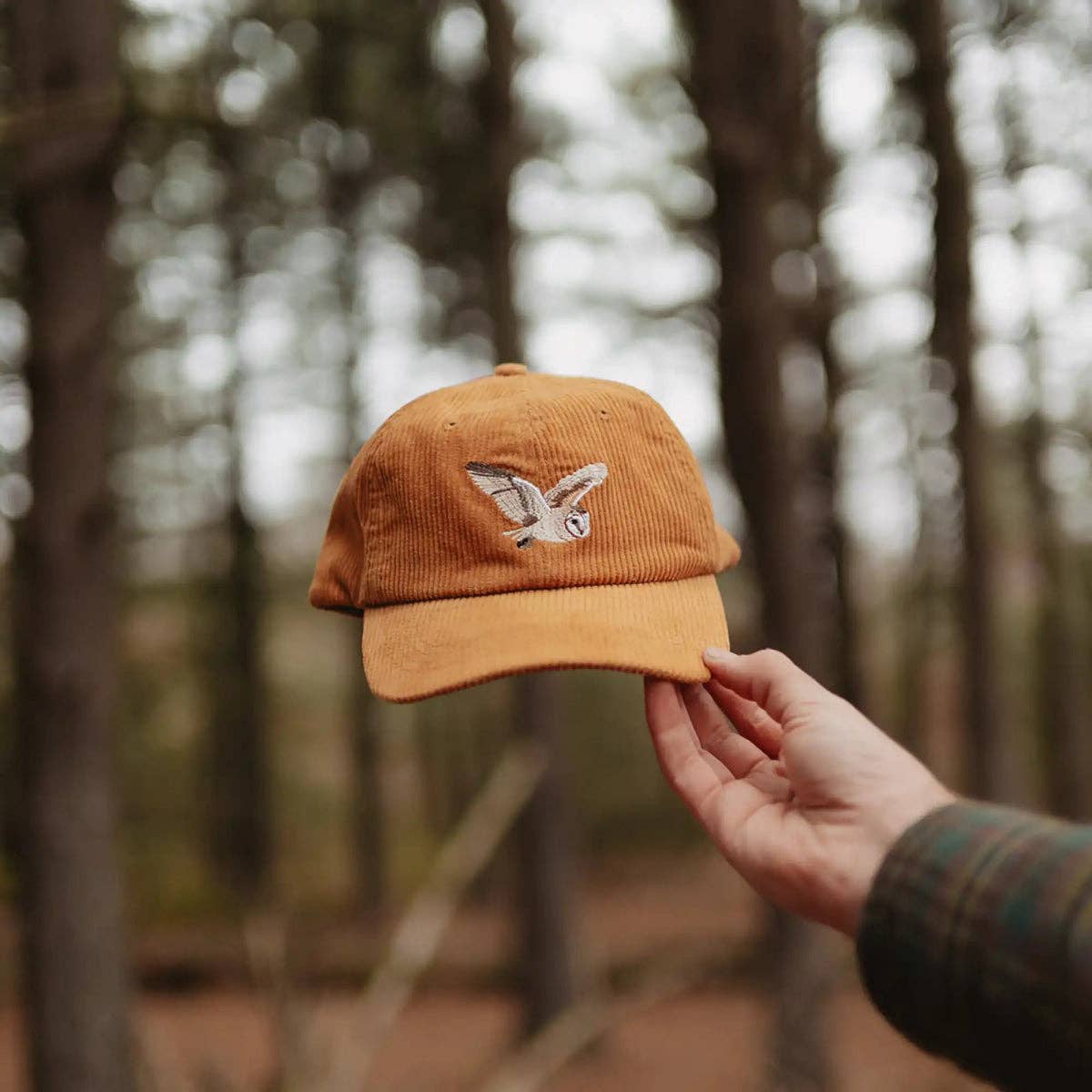 Barn Owl Corduroy Hat in Amber on a model outside at Addison West
