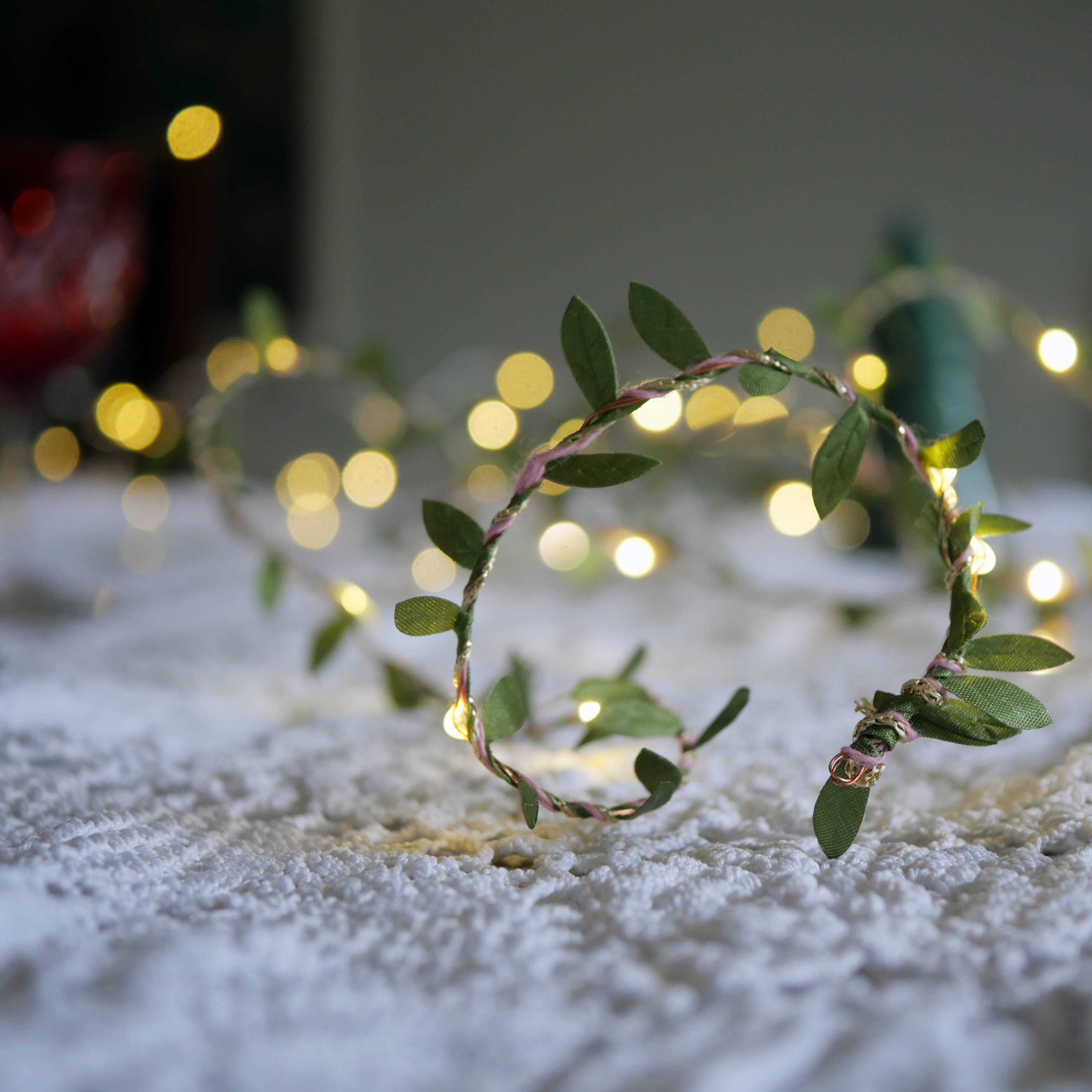 Green Leaf Fairy Light String on a beige background at Addison West