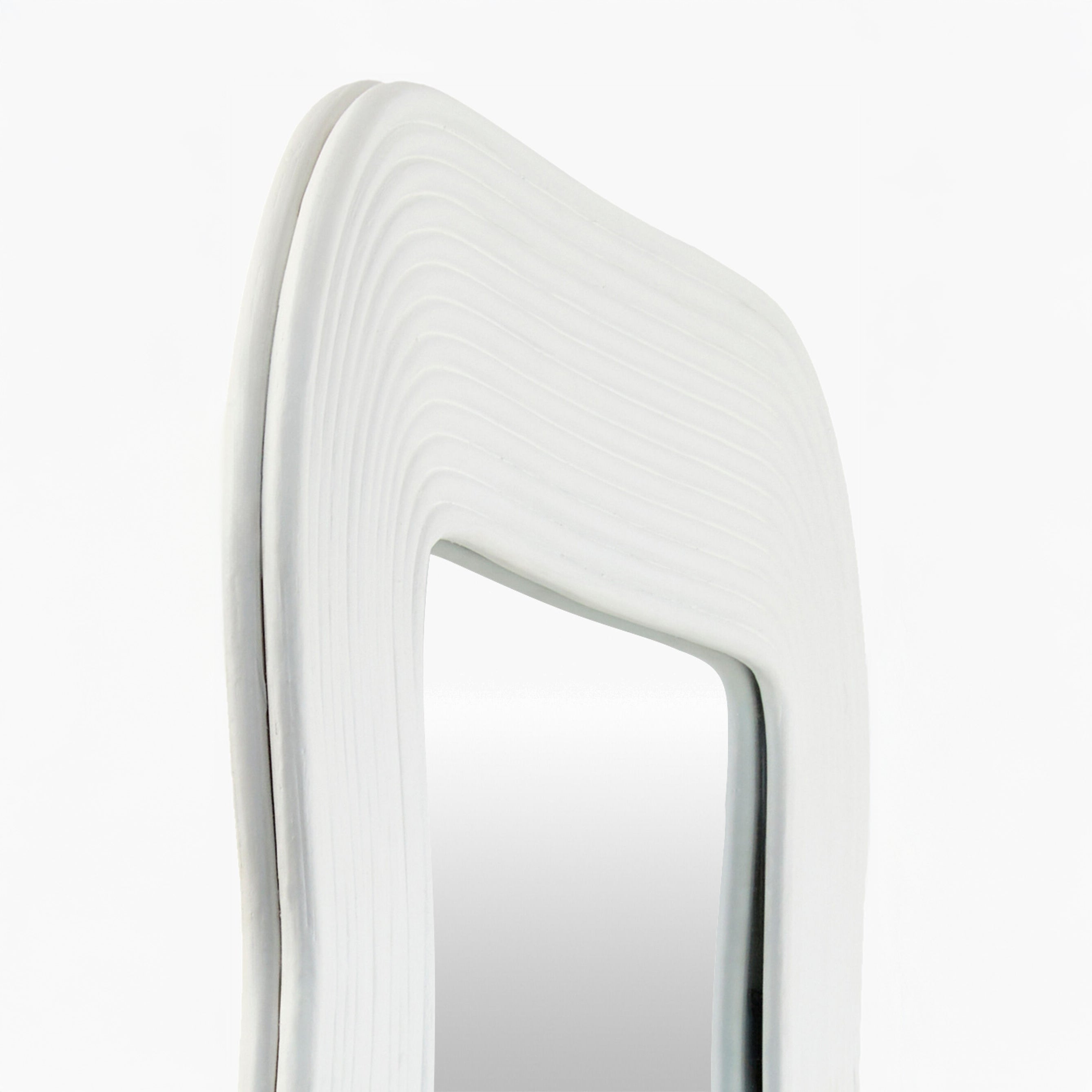 Close up of Dance Accent Mirror in White on a white background at Addison West