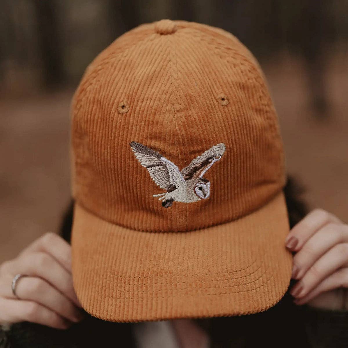 Barn Owl Corduroy Hat in Amber on a model outside at Addison West