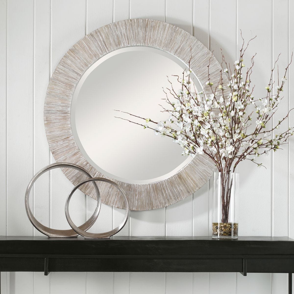 Remere Round Accent Mirror on a white wall above a table at Addison West
