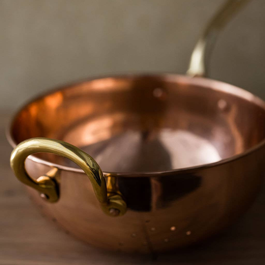 Galley and Fenn Copper Colander on a beige background at Addison West