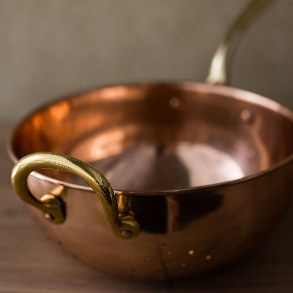 Galley and Fenn Copper Colander on a beige background at Addison West