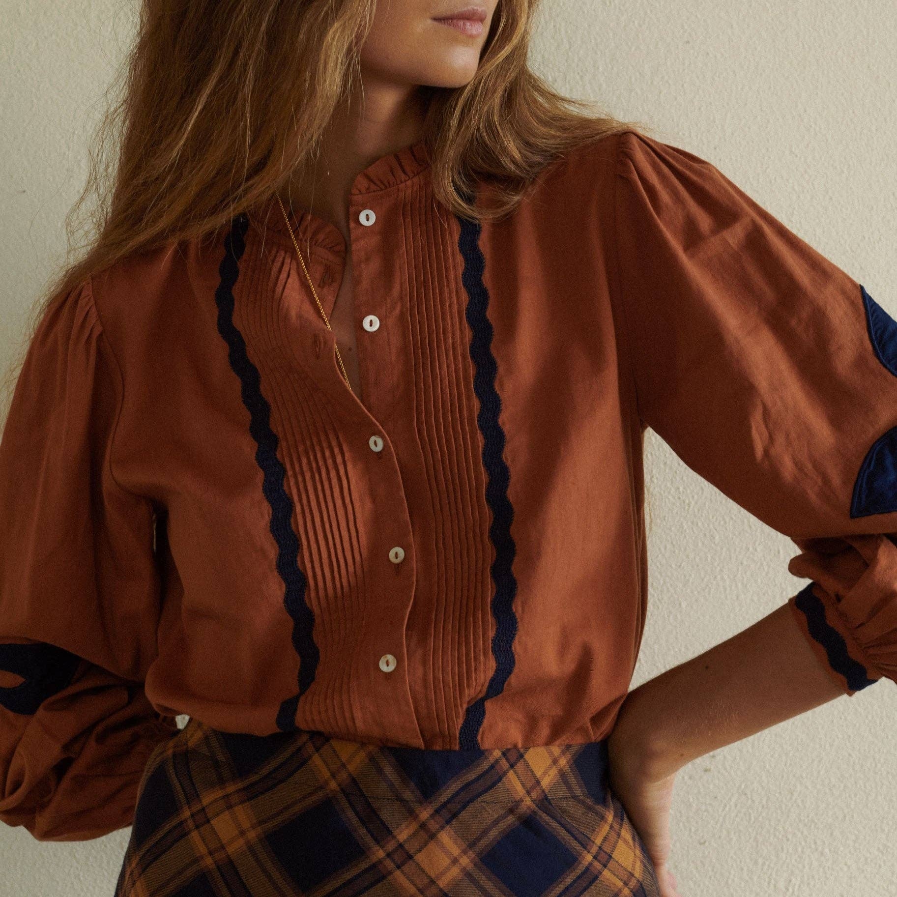 Leonor Blouse in Caramel on a white background at Addison West