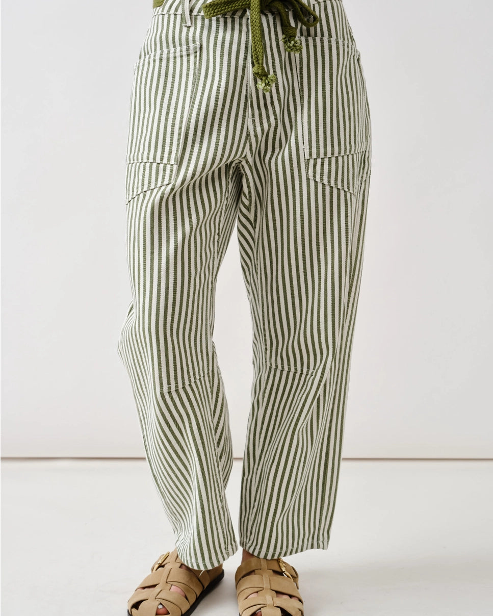 Model wearing green and white stripe barrel jeans with a drawstring on a white background