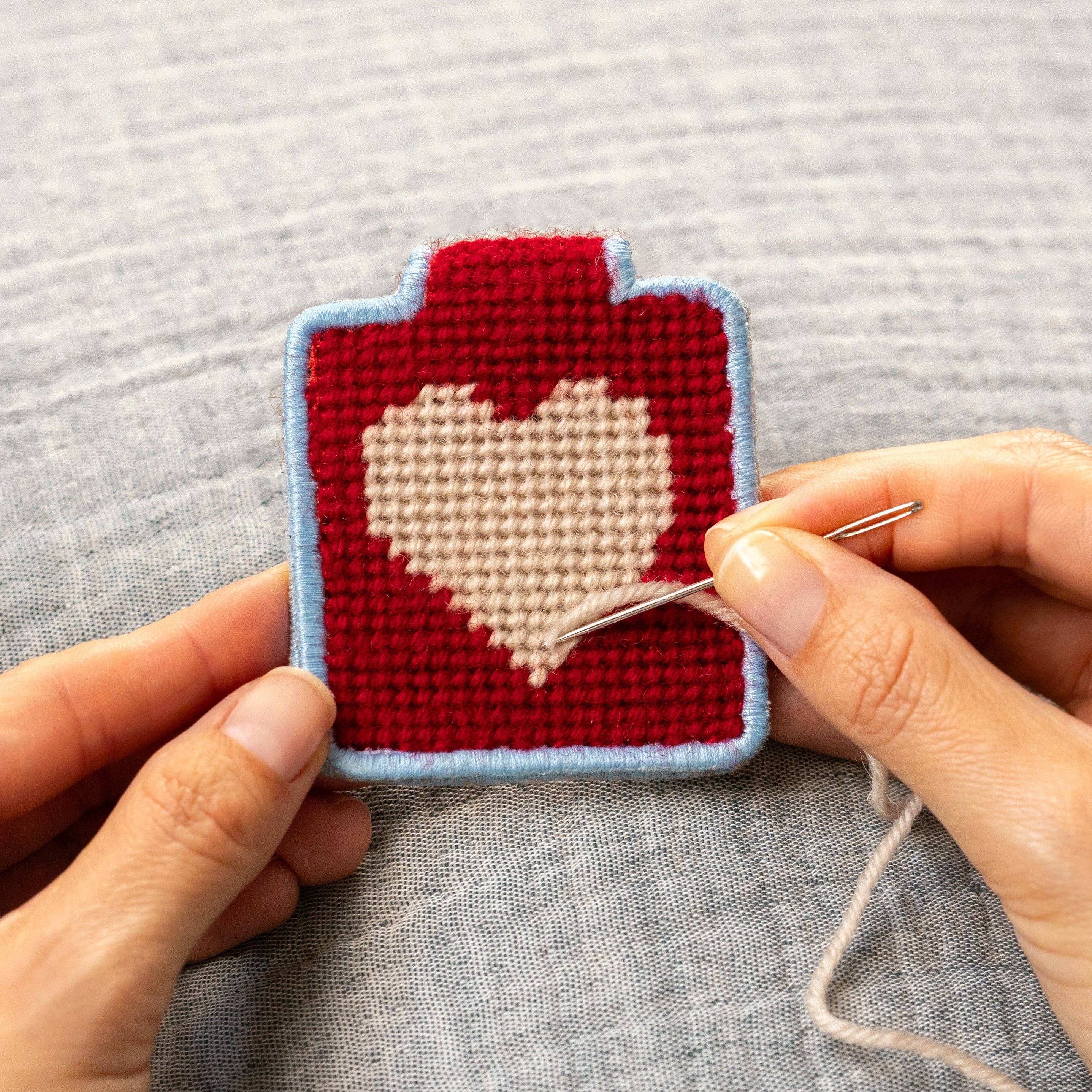Heart Needlepoint Keychain Kit on a grey background at Addison West