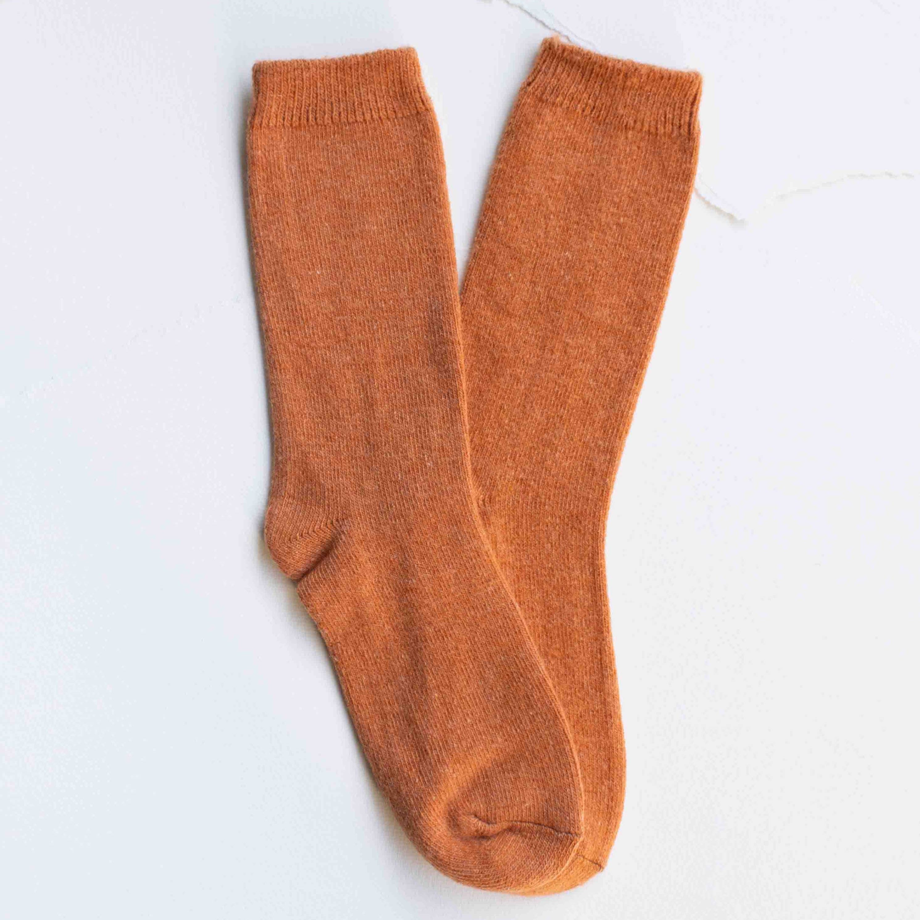 Bright Winter Wool Cashmere Socks in Rust Orange on a white background at Addison West