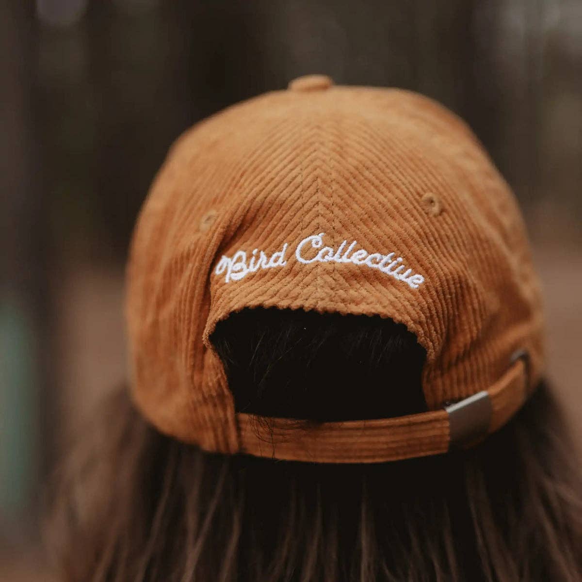 Barn Owl Corduroy Hat in Amber on a model outside at Addison West