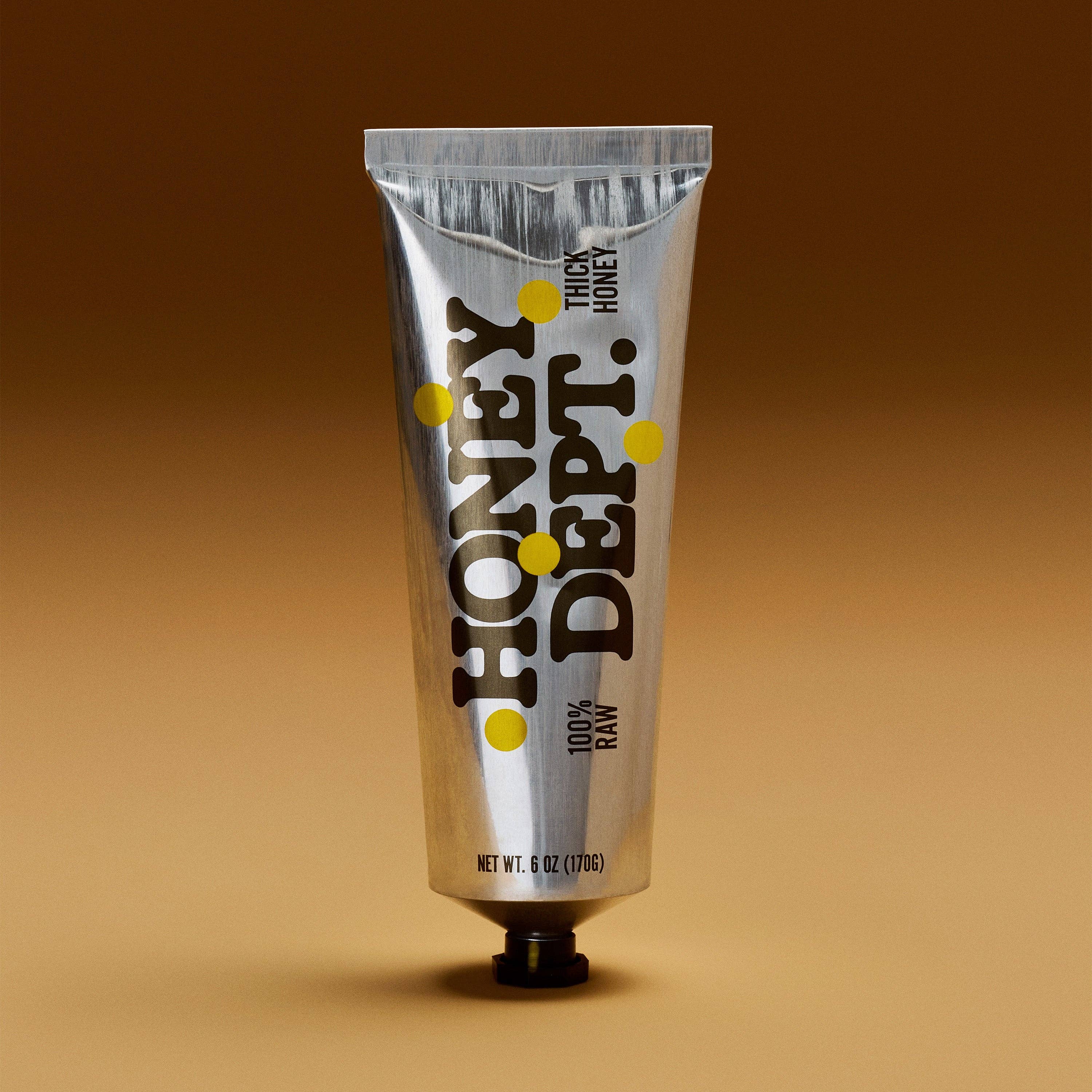 Honey Depot Tube of Honey on a beige background at Addison West