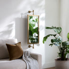 Emmeline Accent Mirror on a white wall in a living room at Addison West