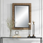 Islenne Accent Mirror on a white wall above a table at Addison West